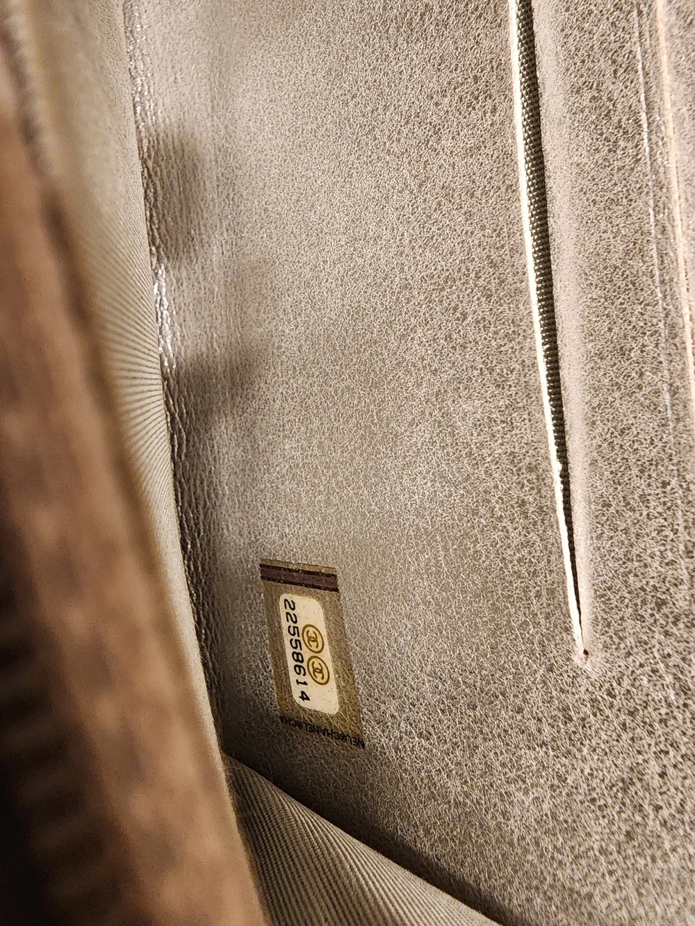 Chanel Timeless CC zip-around wallet features smooth black leather